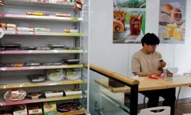 An office worker eats his lunch at a convenience store in Seoul
