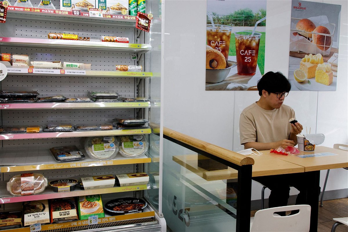 <i>Heo Ran/Reuters via CNN Newsource</i><br/>An office worker eats his lunch at a convenience store in Seoul