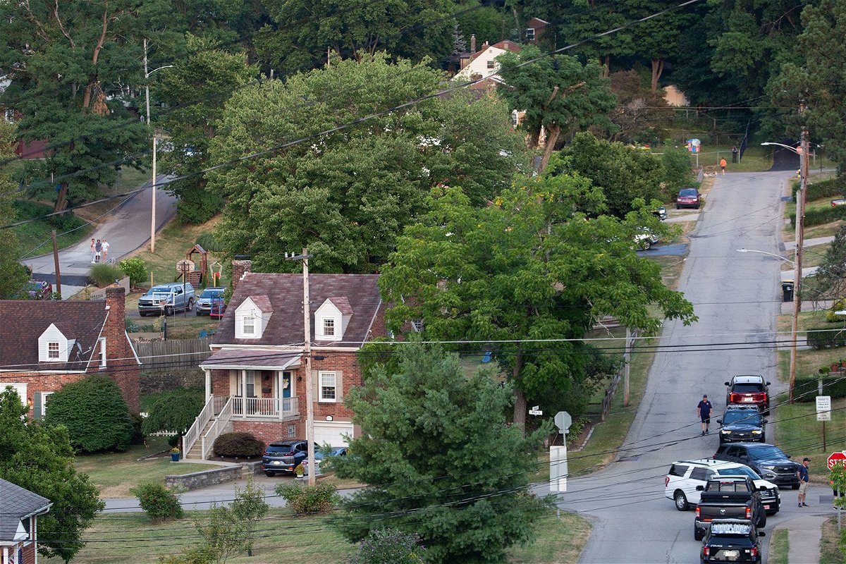 <i>Rebecca Droke/AFP/Getty Images via CNN Newsource</i><br/>Police continue to block roads around the home of Thomas Matthew Crooks as the FBI continues its investigation into the attempted assassination of former US President Donald Trump in Bethel Park