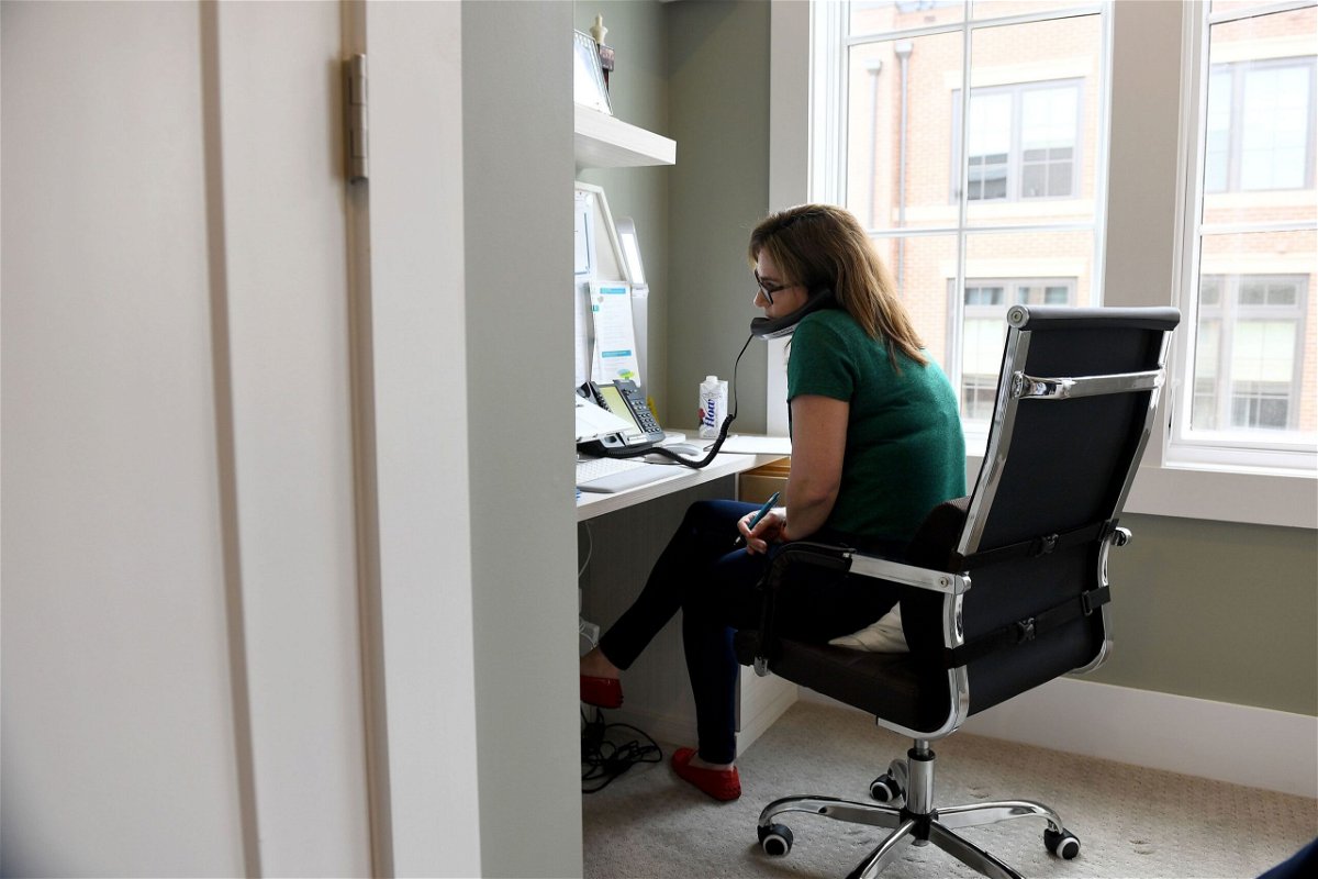<i>Katherine Frey/The Washington Post via Getty Images via CNN Newsource</i><br/>Sue-Ann Siegel works a shift monitoring the Montgomery County Hotline from her home office
