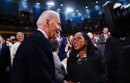 President Joe Biden greets Justice Ketanji Brown Jackson