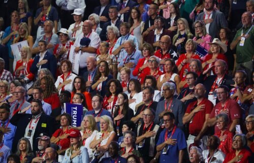 Attendees recite the pledge of allegiance on the second day of the Republican National Convention in Milwaukee on July 16