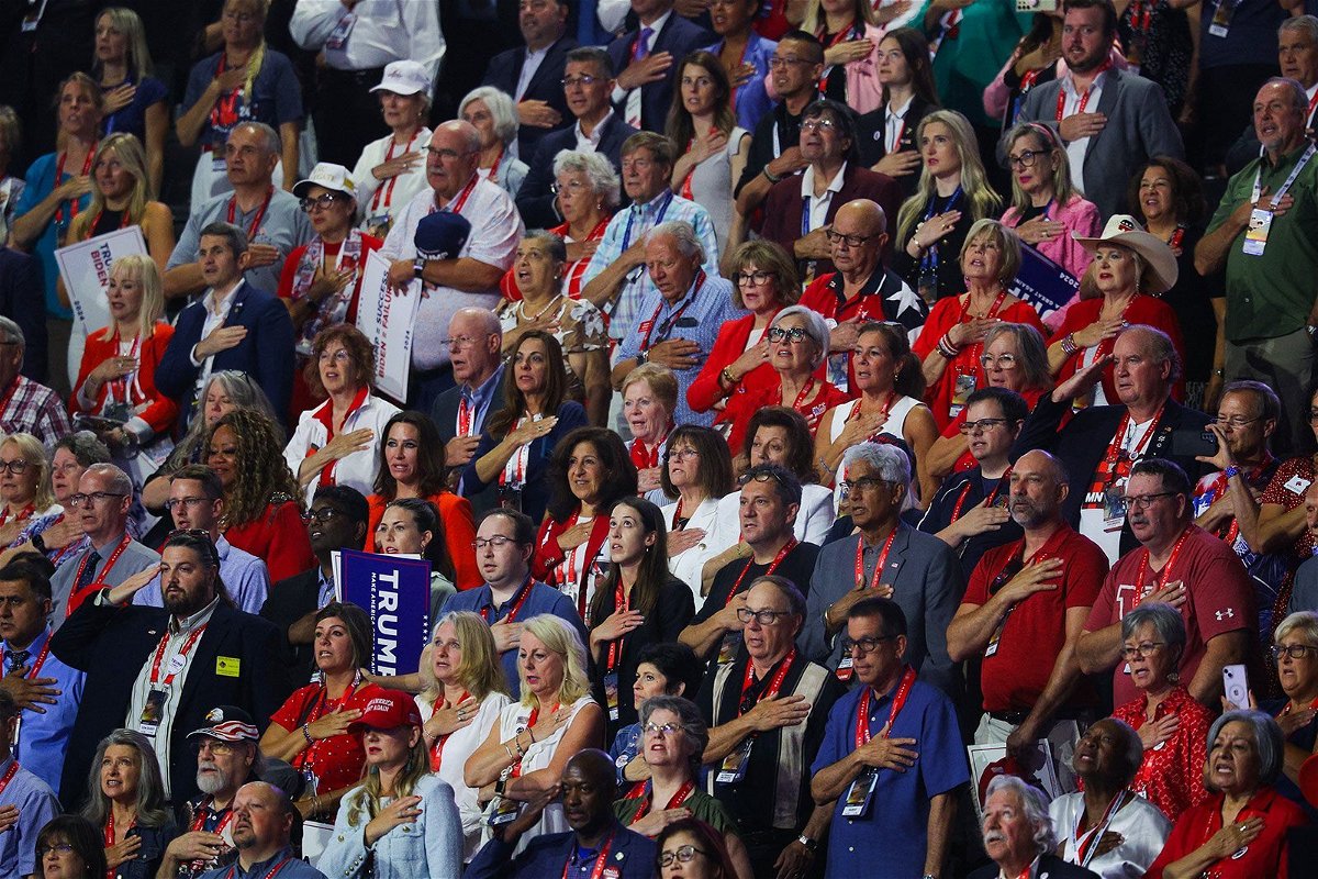 <i>Brian Snyder/Reuters via CNN Newsource</i><br/>Attendees recite the pledge of allegiance on the second day of the Republican National Convention in Milwaukee on July 16