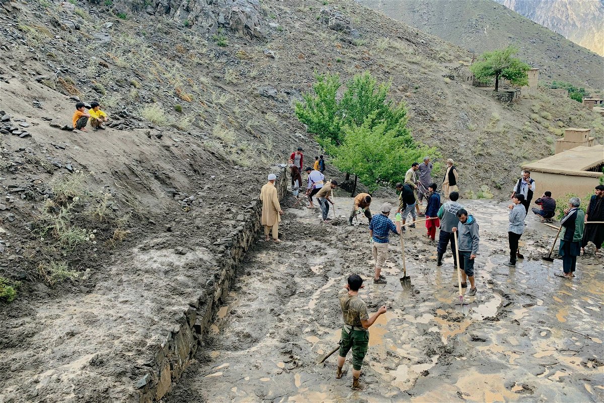 <i>AFP/Getty Images via CNN Newsource</i><br/>Afghan residents shovel mud following flash floods after heavy rainfall at Pesgaran village in Dara district