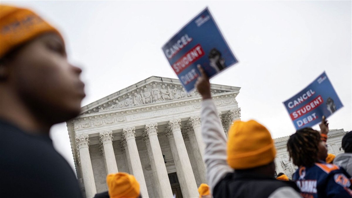 <i>Andrew Caballero-Reynolds/AFP/Getty Images via CNN Newsource</i><br/>Activists and students protest in front of the Supreme Court during a rally for student debt cancellation in Washington