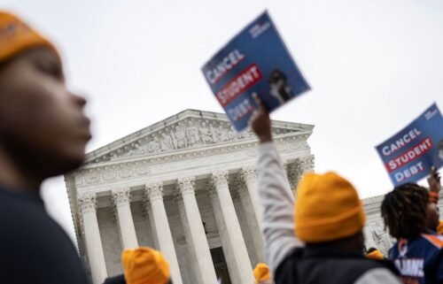Activists and students protest in front of the Supreme Court during a rally for student debt cancellation in Washington