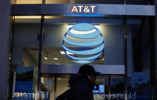 A person walks past an AT&T Store in Midtown Manhattan on January 23