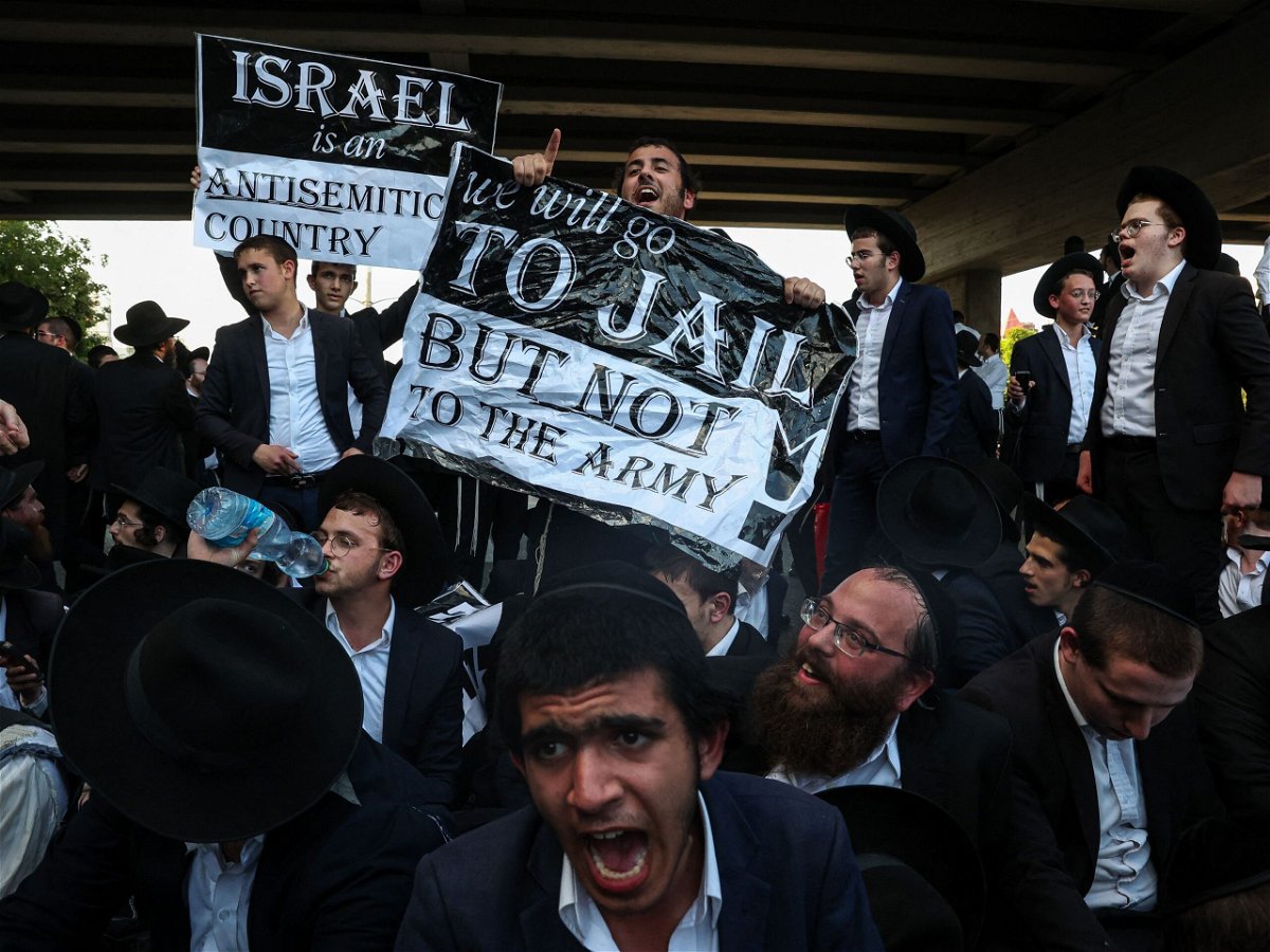 <i>Itai Ron/Middle East Images/AFP/Getty Images via CNN Newsource</i><br/>Ultra-Orthodox Jewish men protest against the draft on July 16