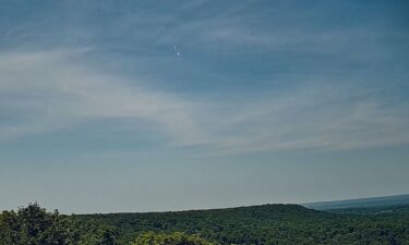 A video still captures a rare daytime fireball streaking over Northford