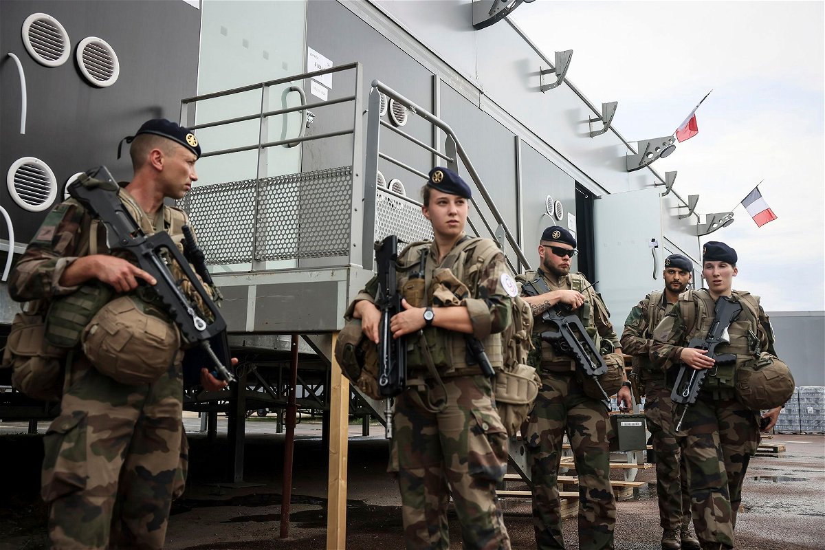 <i>Thomas Padilla/AP via CNN Newsource</i><br/>Soldiers leave for a patrol at the military camp set up on the outskirts of Paris.