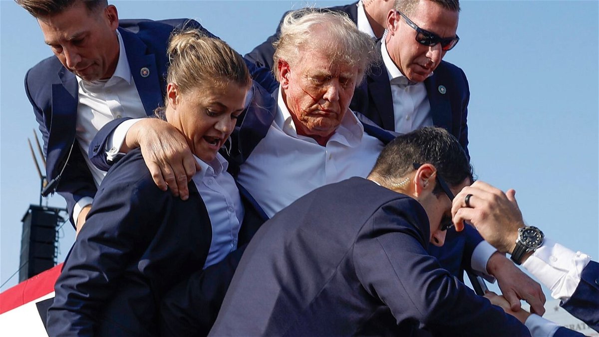 <i>Anna Moneymaker/Getty Images via CNN Newsource</i><br/>Former President Donald Trump is rushed offstage by U.S. Secret Service agents after being grazed by a bullet during a rally on July 13