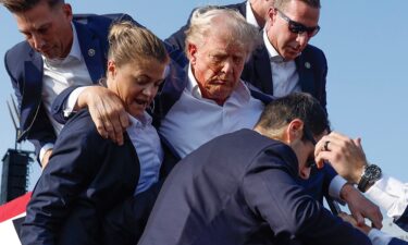 Former President Donald Trump is rushed offstage by U.S. Secret Service agents after being grazed by a bullet during a rally on July 13