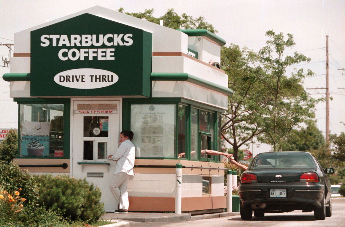 <i>Tim Boyle/Newsmakers/Hulton Archive/Getty Images via CNN Newsource</i><br/>Starbucks built its first drive-thru in 1994.