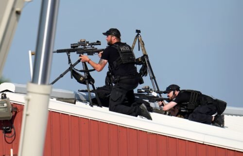 Law enforcement snipers return fire after shots were fired while former President Donald Trump was speaking at his rally.