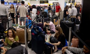 Widespread IT problems are currently impacting global travel. Pictured here: passengers at London's Gatwick Airport amid the disruption.