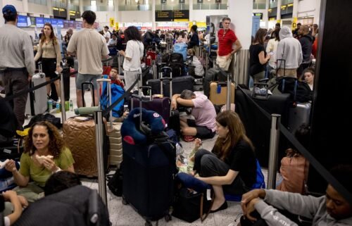 Widespread IT problems are currently impacting global travel. Pictured here: passengers at London's Gatwick Airport amid the disruption.