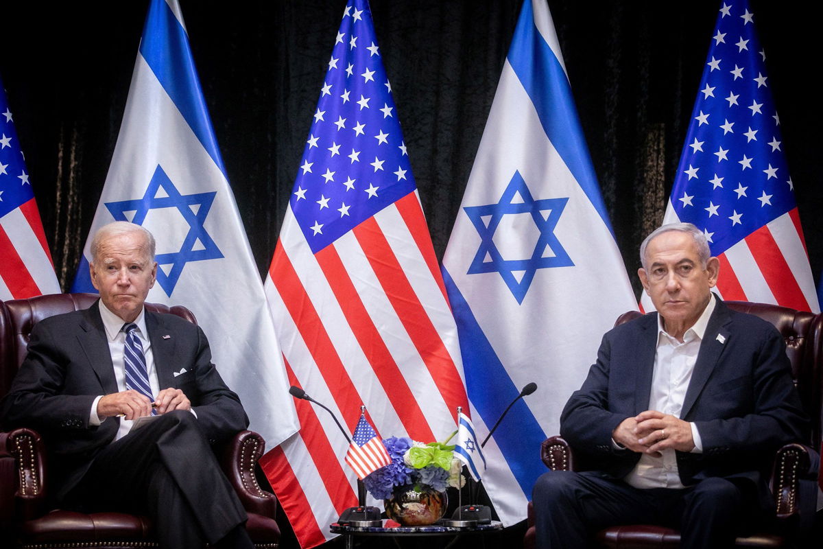 <i>Miriam Alster/Pool/AFP/Getty Images/File via CNN Newsource</i><br/>President Joe Biden sits with Israeli Prime Minister Benjamin Netanyahu at an Israeli war cabinet meeting