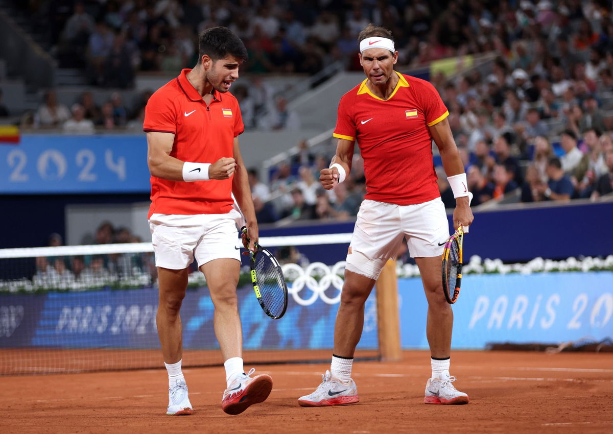 <i>Clive Brunskill/Getty Images via CNN Newsource</i><br/>Nadal and Alcaraz celebrate during their competitive doubles debut.