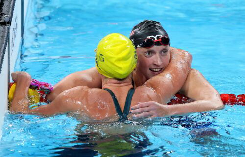 Katie Ledecky embraces Australia's Titmus after the race.