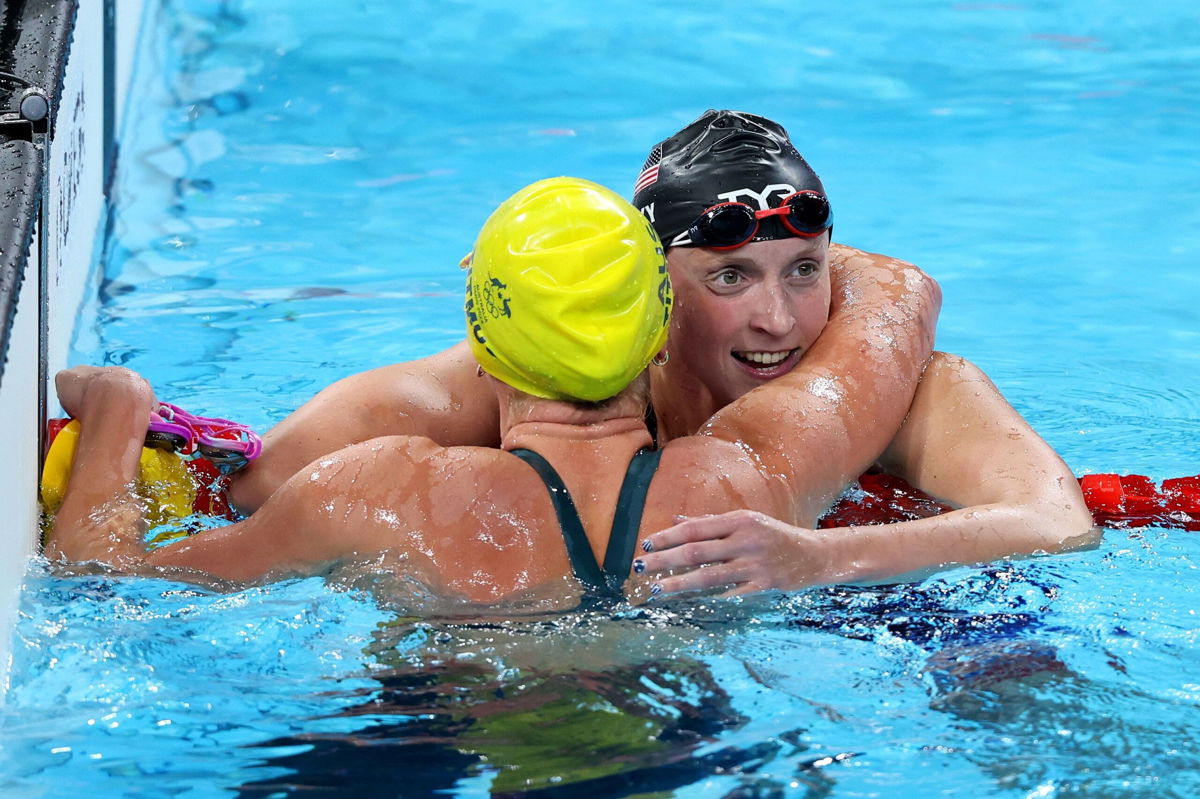 <i>Quinn Rooney/Getty Images via CNN Newsource</i><br/>Katie Ledecky embraces Australia's Titmus after the race.