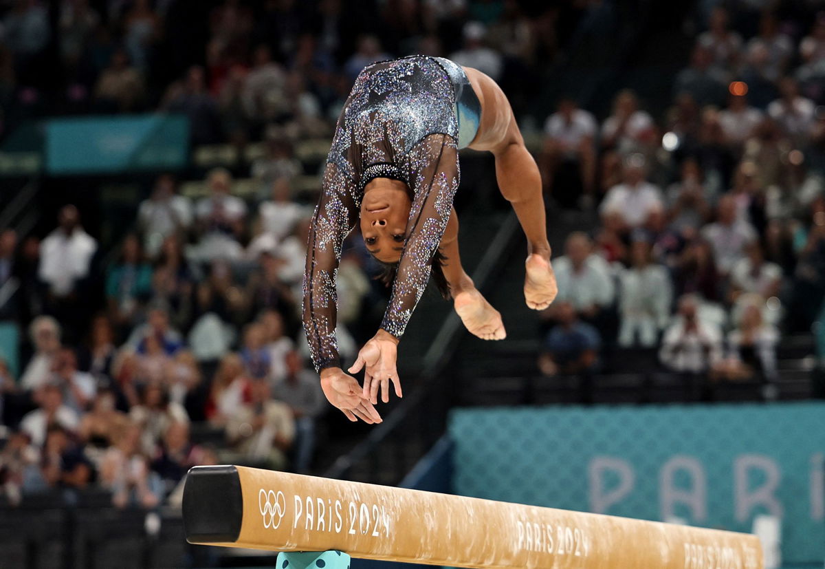 <i>Mike Blake/Reuters via CNN Newsource</i><br/>Simone Biles competes in the qualifying round at the Paris Olympics.