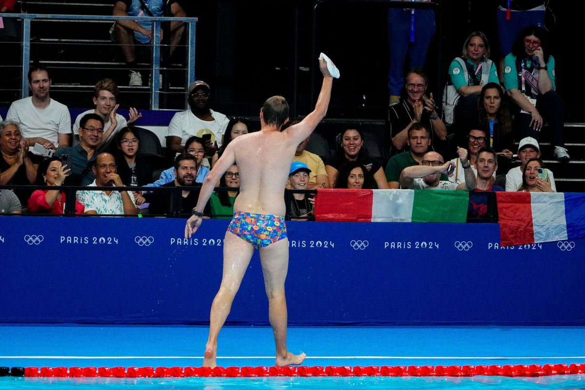 <i>Rob Schumacher/USA Today Sports/Reuters via CNN Newsource</i><br/>The crowd cheers for a man who retrieved Emma Weber’s (USA) swim cap from the pool during the women’s 100-meter breaststroke prelim heats at Paris La Défense Arena.