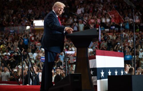 Former President Donald Trump arrives to speak during a rally at Herb Brooks National Hockey Center on July 27