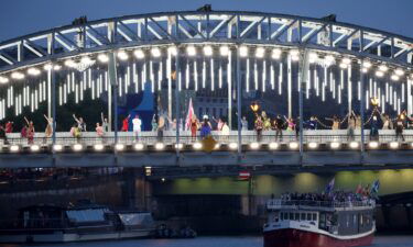 Performers are seen on a catwalk erected along the Passerelle Debilly bridge in Paris during the opening ceremony.