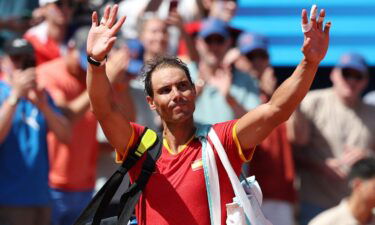 Rafael Nadal waves after losing his match against Novak Djokovic.