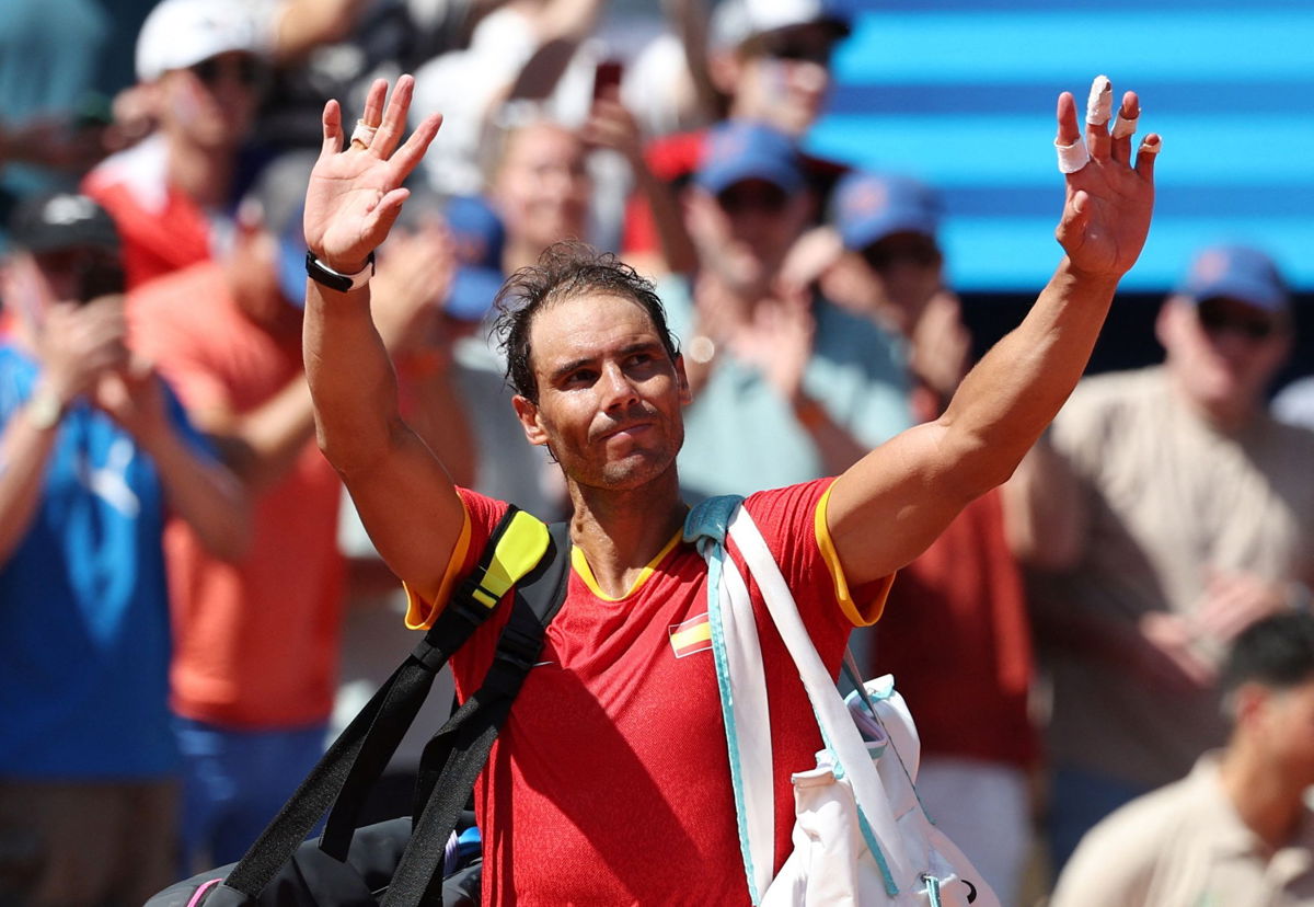 <i>Violeta Santos Moura/Reuters via CNN Newsource</i><br/>Rafael Nadal waves after losing his match against Novak Djokovic.