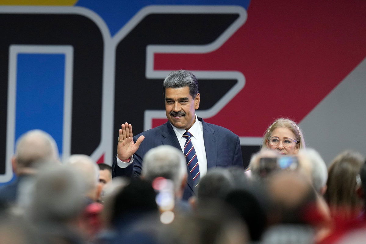 <i>Matias Delacroix/AP via CNN Newsource</i><br/>Venezuelan President Nicolas Maduro arrives with his wife Cilia Flores for a ceremony where the National Electoral Council (CNE) certified he won the presidential election.