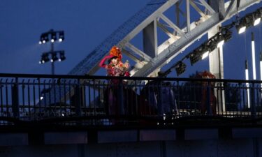 Drag queens prepare to perform on the Debilly Bridge in Paris during the opening ceremony of the 2024 Summer Olympics on July 26