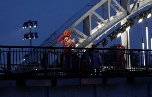 Drag queens prepare to perform on the Debilly Bridge in Paris during the opening ceremony of the 2024 Summer Olympics on July 26