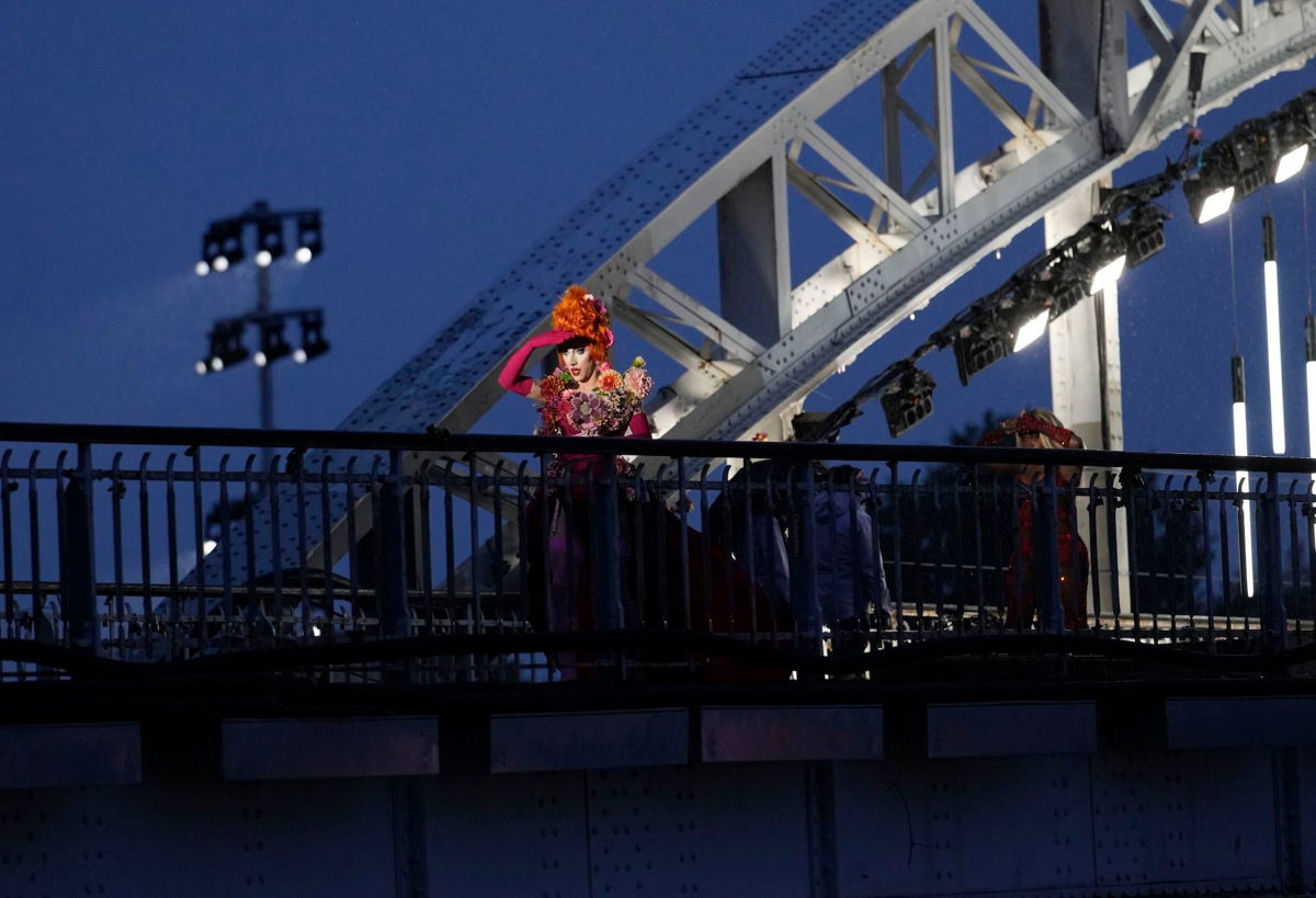 <i>Tsvangirayi Mukwazhi/AP via CNN Newsource</i><br/>Drag queens prepare to perform on the Debilly Bridge in Paris during the opening ceremony of the 2024 Summer Olympics on July 26