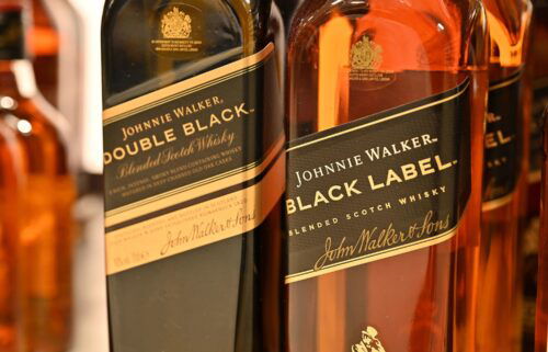 Bottles of Johnnie Walker Black Label and Double Black blended scotch whisky are displayed for sale in January in Leigh on Sea