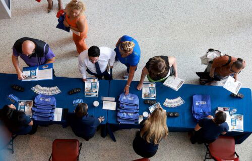Job seekers attend the South Florida Job Fair on June 26 in Sunrise