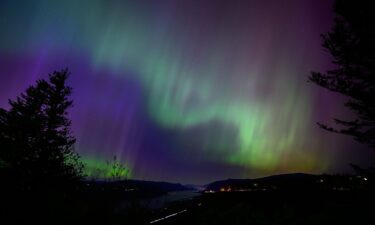 The Northern Lights are seen above the Columbia River Gorge from Chanticleer Point Lookout in the early morning hours of May 11