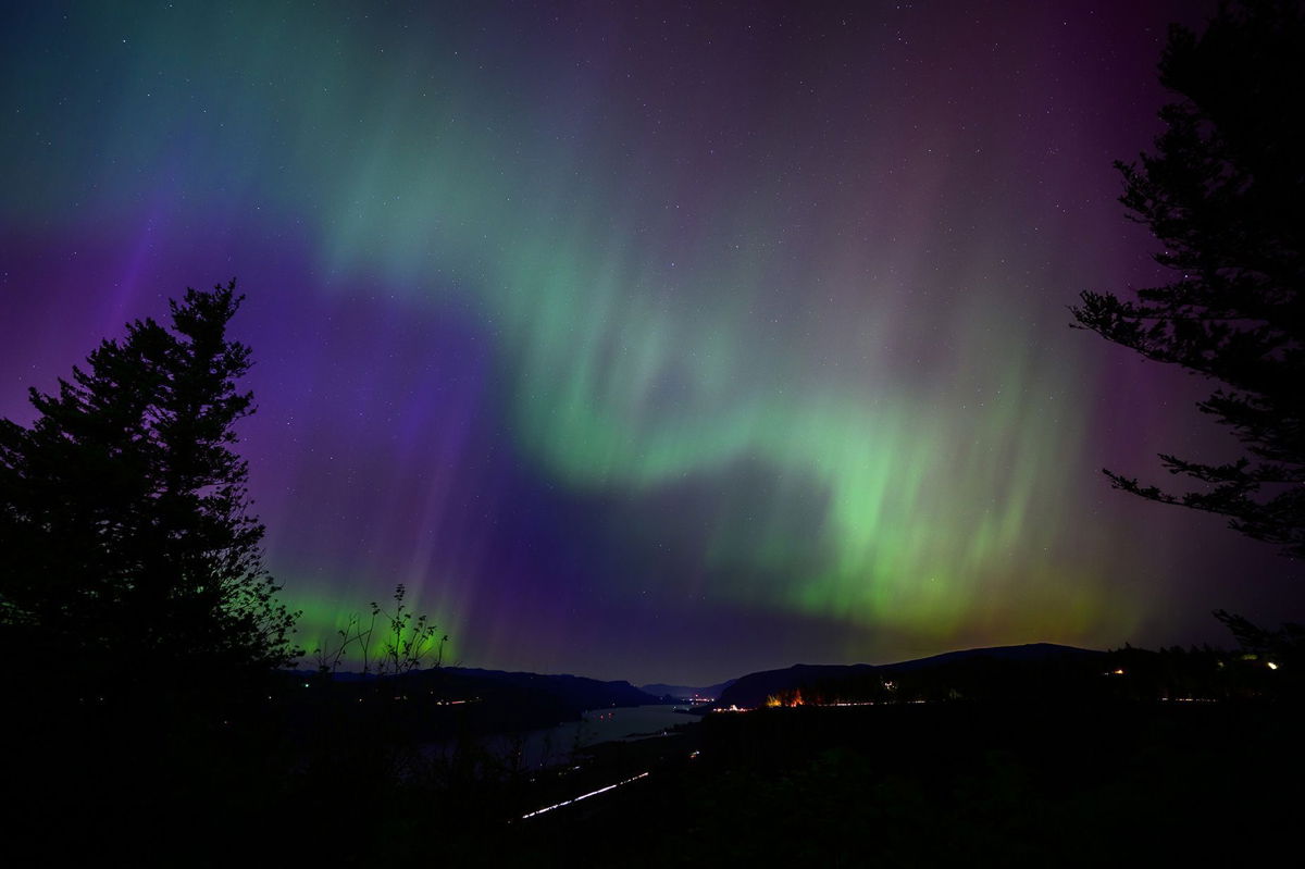 <i>Mathieu Lewis-Rolland/Getty Images/FILE via CNN Newsource</i><br/>The Northern Lights are seen above the Columbia River Gorge from Chanticleer Point Lookout in the early morning hours of May 11
