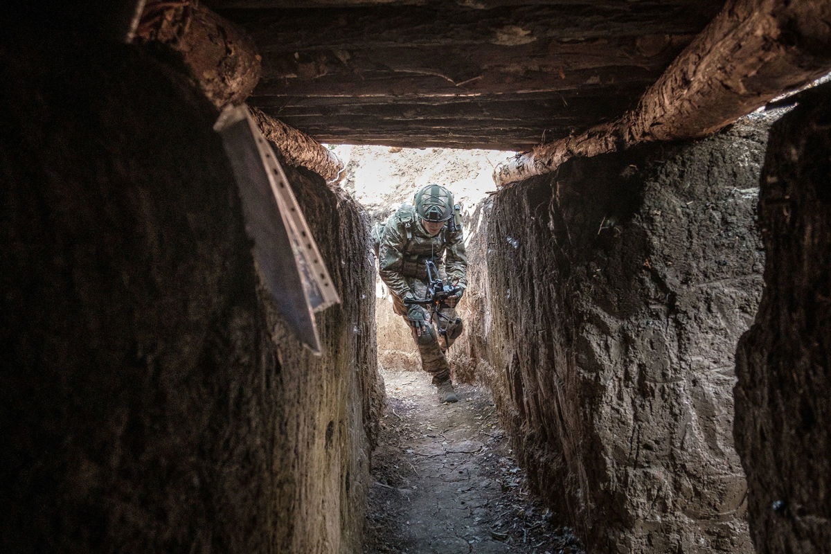 <i>Pablo Miranzo/Anadolu/Getty Images via CNN Newsource</i><br/>A Ukrainian soldier runs to a shelter in the Pokrovsk area of Ukraine on July 23.