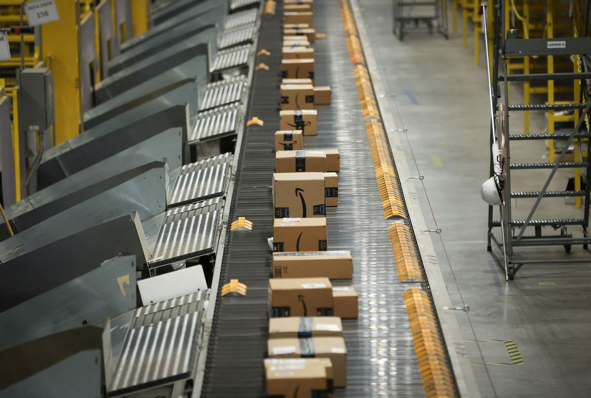 <i>Mike Segar/Reuters via CNN Newsource</i><br/>Packages travel on a conveyor during Cyber Monday at the Amazon's fulfillment center in Robbinsville
