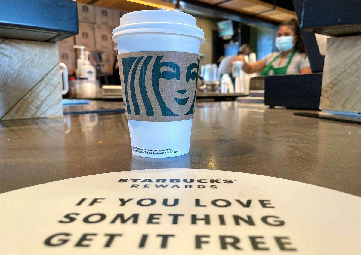 <i>Justin Sullivan/Getty Images via CNN Newsource</i><br/>The Starbucks logo is displayed on a cup at a Starbucks store in October 2021 in Marin City