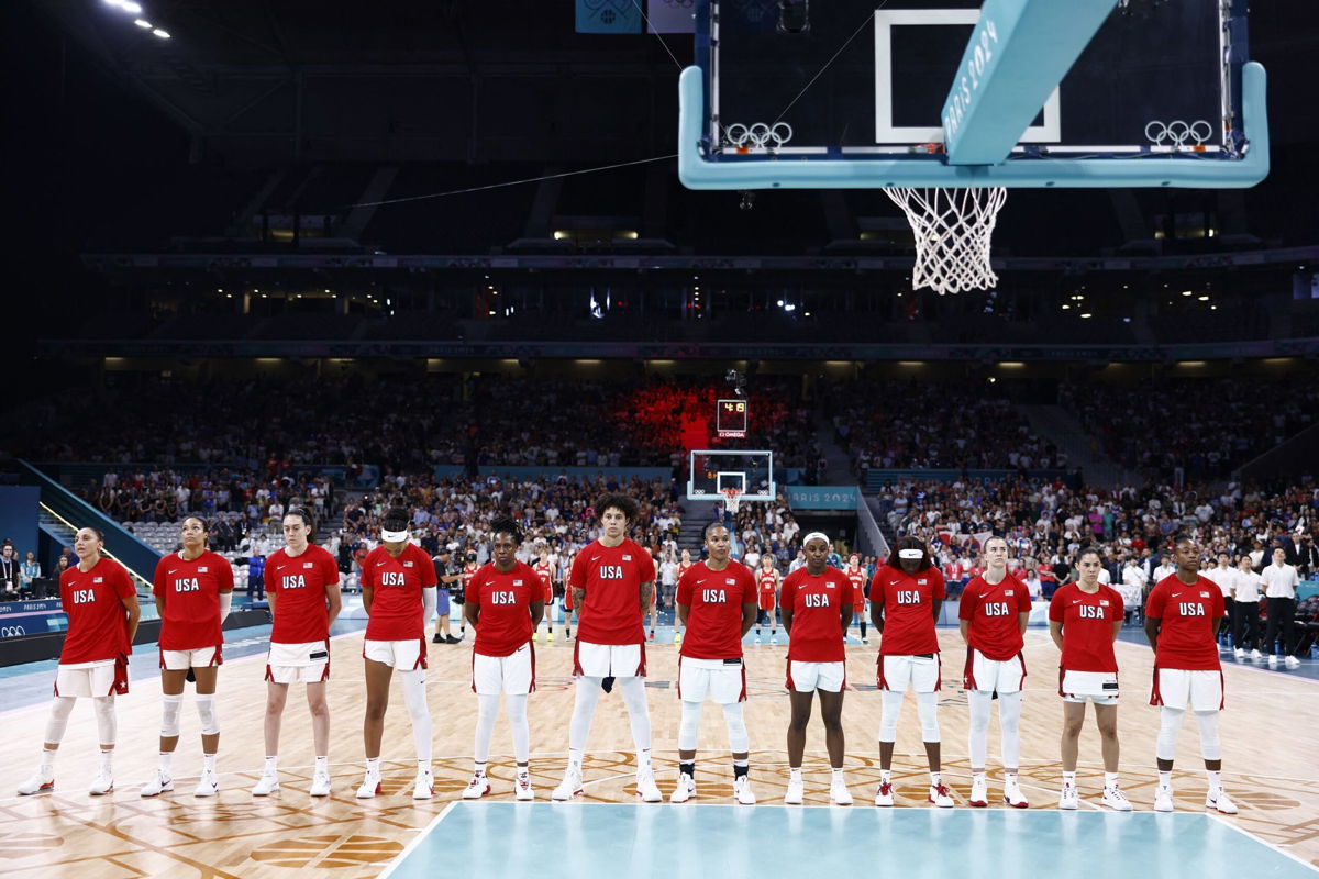 <i>Sameer Al-Doumy/AFP/Getty Images via CNN Newsource</i><br/>Team USA players stand during Japan's national anthem before their group match at the Paris 2024 Olympic Games.