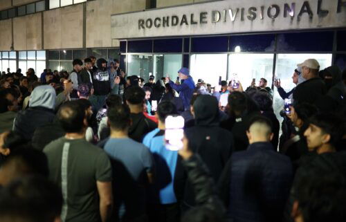 Protesters are seen outside Rochdale Divisional Headquarters in Manchester