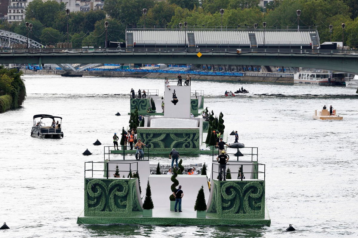<i>Fu Tian/China News Service/VCG/Getty Images via CNN Newsource</i><br/>Boats and cast members rehearse on the River Seine for the Opening Ceremony of Paris 2024 Olympic Games on July 24.