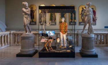 Swift's Versace outfit and facial hair from the video's yacht scene are on display