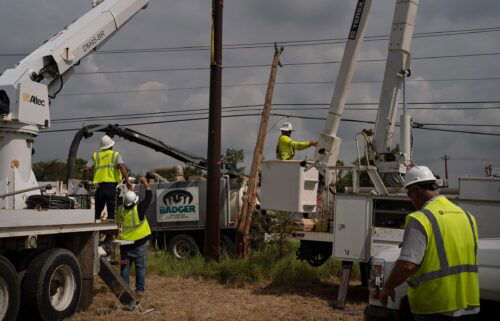 CenterPoint foreign assistance crews work to restore power lines on July 11 in Houston