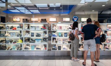 A family views shoes at a Sketchers retail store at the Barton Creek Square Mall on July 16