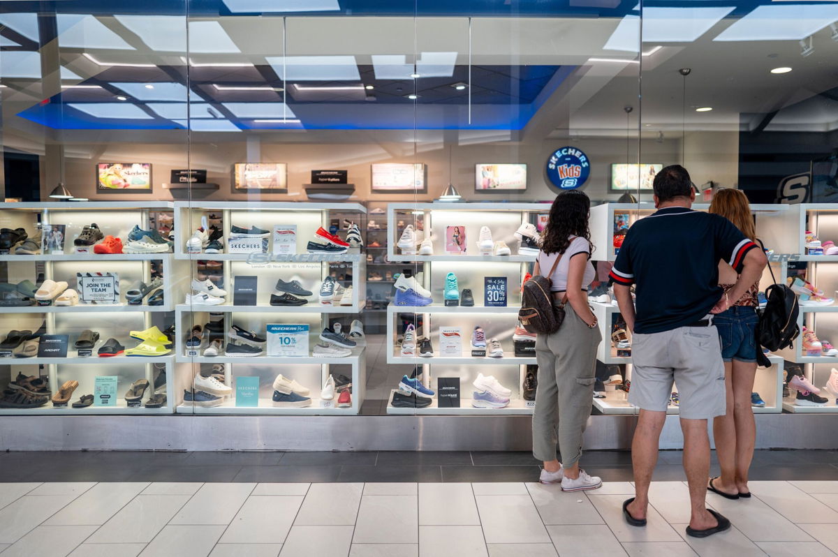 <i>Brandon Bell/Getty Images via CNN Newsource</i><br/>A family views shoes at a Sketchers retail store at the Barton Creek Square Mall on July 16