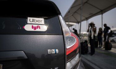 Uber and Lyft stickers displayed on a car at LAX Rideshare Lot 1. The California Supreme Court dismissed a lawsuit by the SEIU and four drivers who say that Proposition 22