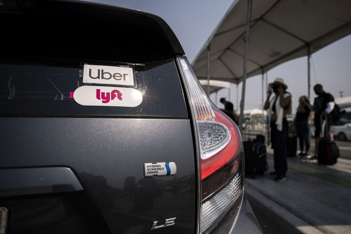 <i>Etienne Laurent/EPA-EFE/Shutterstock via CNN Newsource</i><br/>Uber and Lyft stickers displayed on a car at LAX Rideshare Lot 1. The California Supreme Court dismissed a lawsuit by the SEIU and four drivers who say that Proposition 22